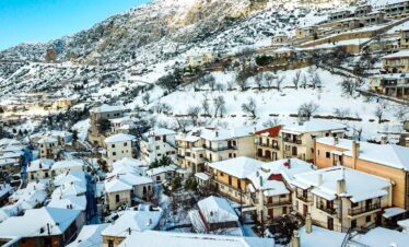 Snow-covered village of Arachova on Mount Parnassus, a picturesque winter getaway near Athens, Greece.