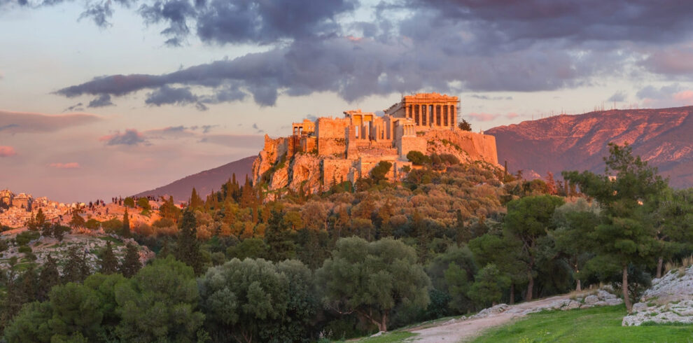 Acropolis of Athens at sunset with the Parthenon overlooking the city, iconic landmark of an Athens city break.
