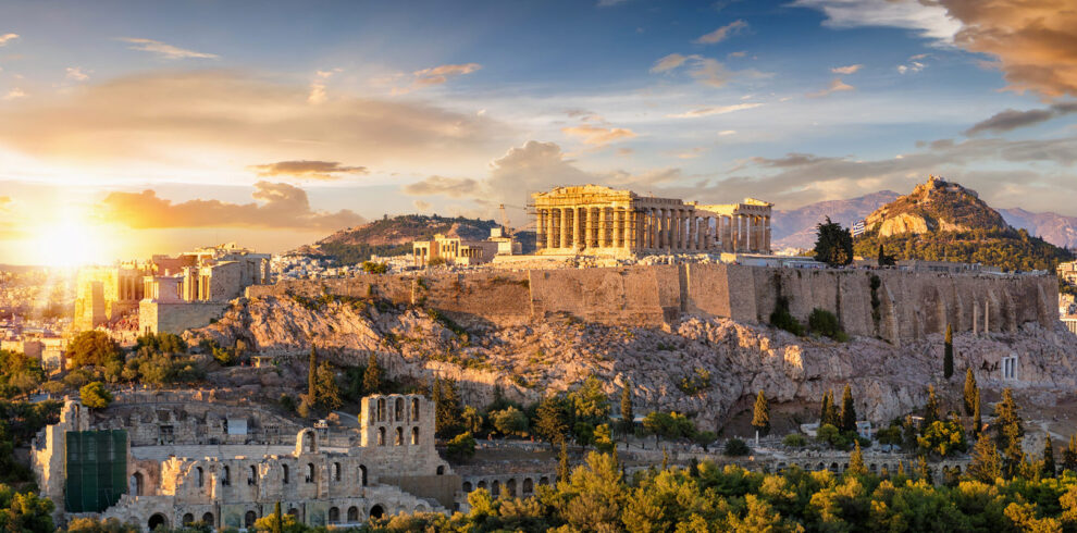 Panoramic view of the Acropolis and Parthenon in Athens at sunset, a highlight of any Athens city break.