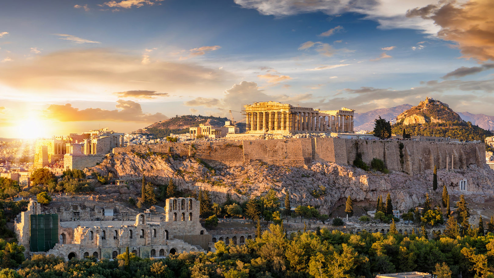 Panoramic view of the Acropolis and Parthenon in Athens at sunset, a highlight of any Athens city break.