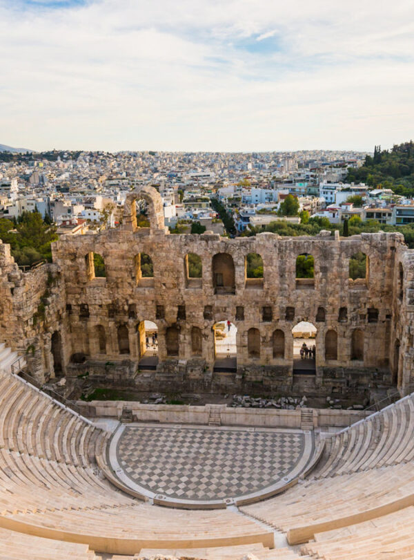 The ancient Odeon of Herodes Atticus amphitheater on the Acropolis hill with panoramic views of Athens city.