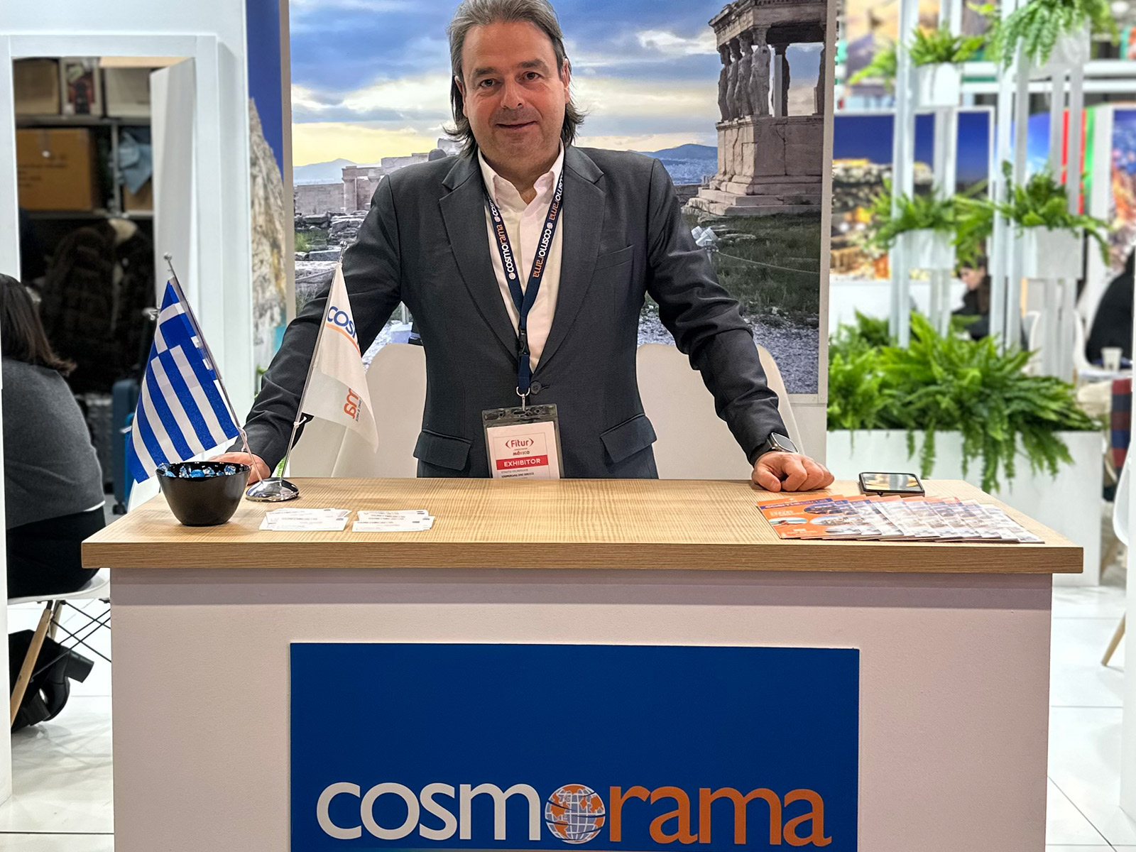 Cosmorama DMC representative at the company stand during FITUR 2026, presenting Greece travel experiences in Madrid.
