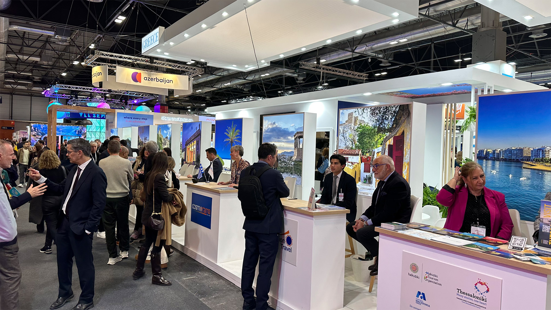 "Cosmorama DMC representatives networking with partners at the Greek National Tourism Organization stand during FITUR 2026 in Madrid."
