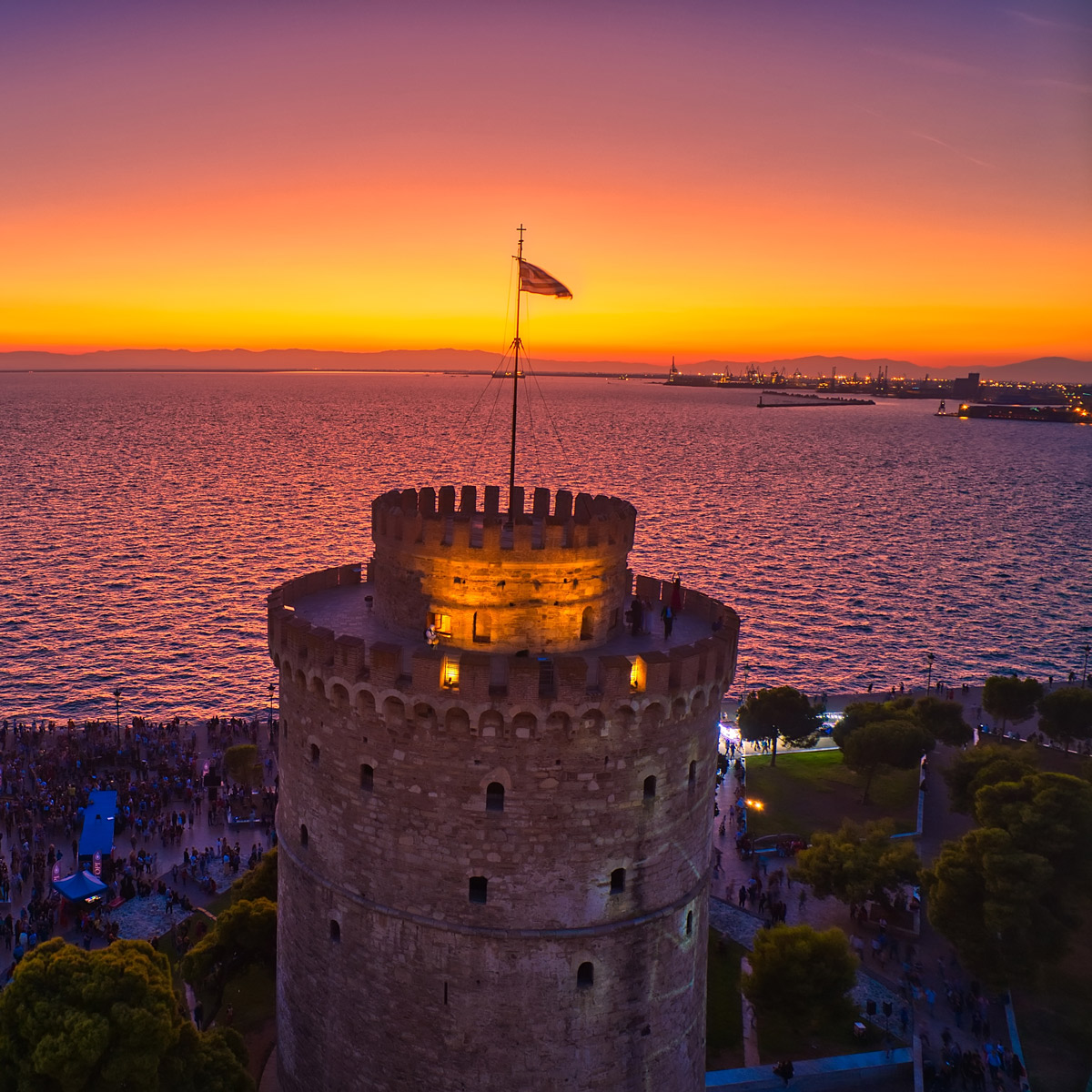 The White Tower of Thessaloniki against a sunset over the Thermaic Gulf